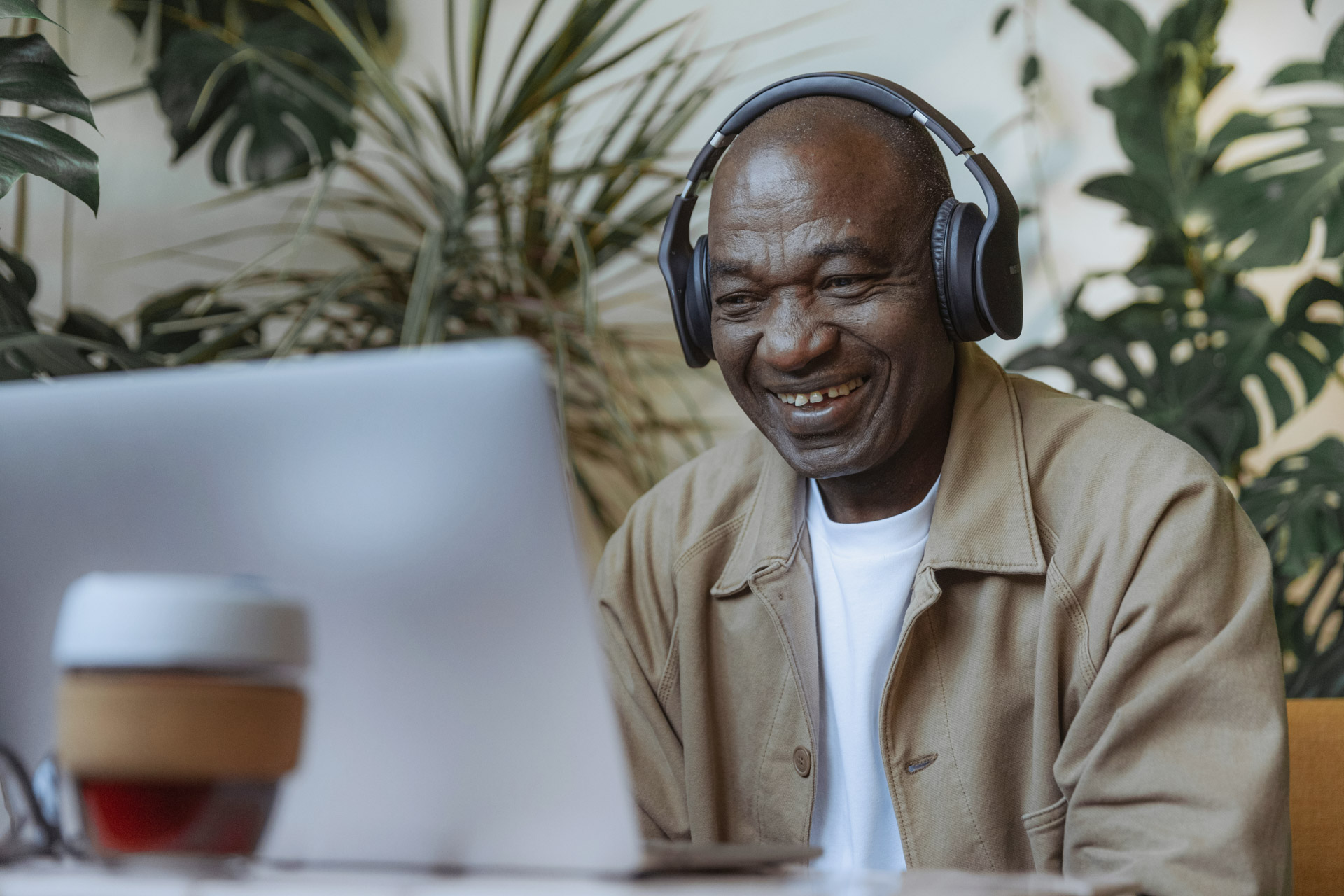 Adela Bio | Toronto, San Fransisco | A breakthrough approach to cancer detection [african american man using the computer and listening to headphones]